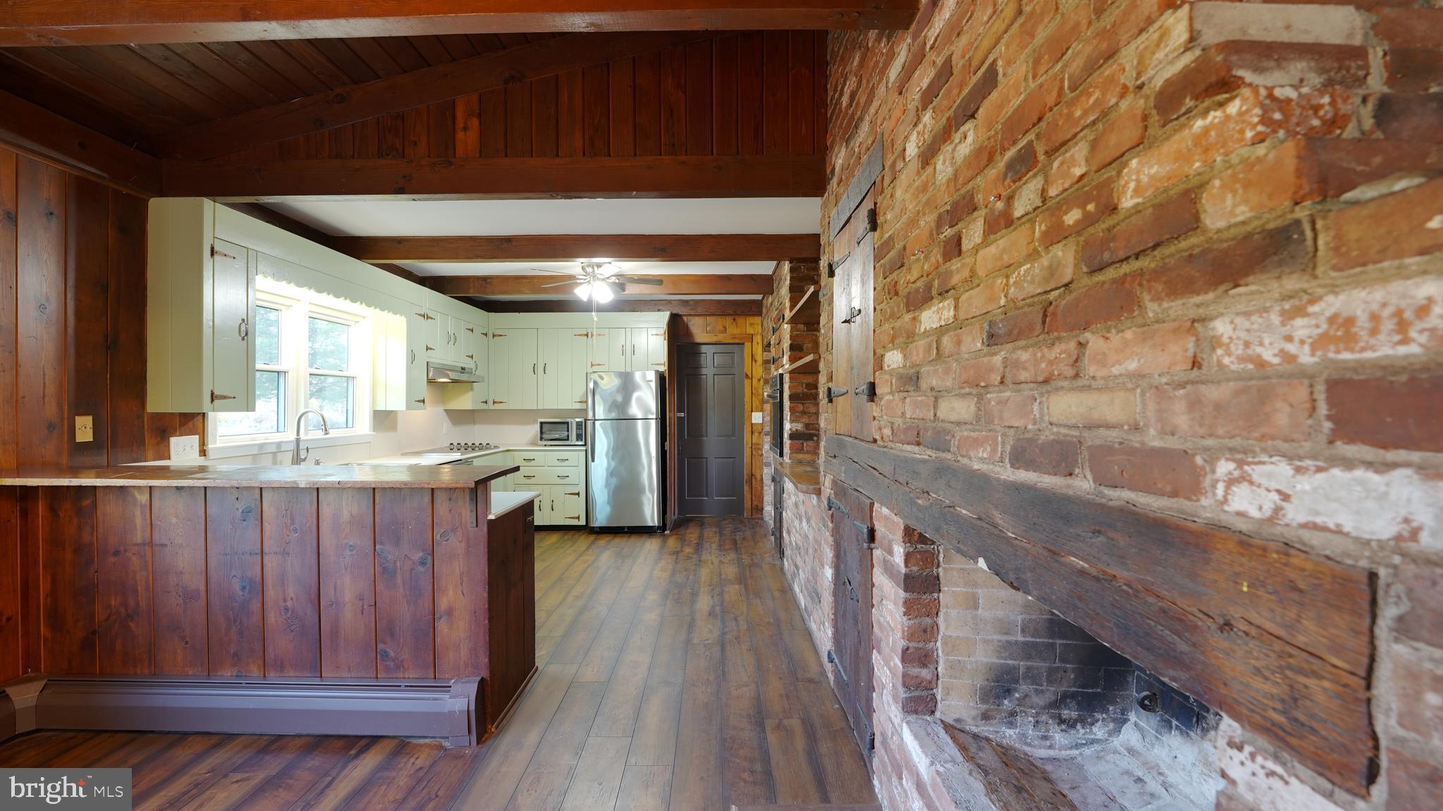 53 Iron Bridge Road Pipersville, PA 18947 - Photo 10 of 28 a kitchen with stainless steel appliances wooden cabinets and a counter top space