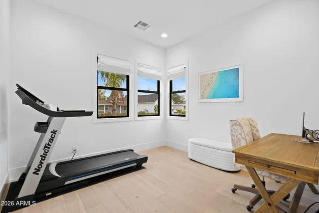 a bedroom with furniture and a window