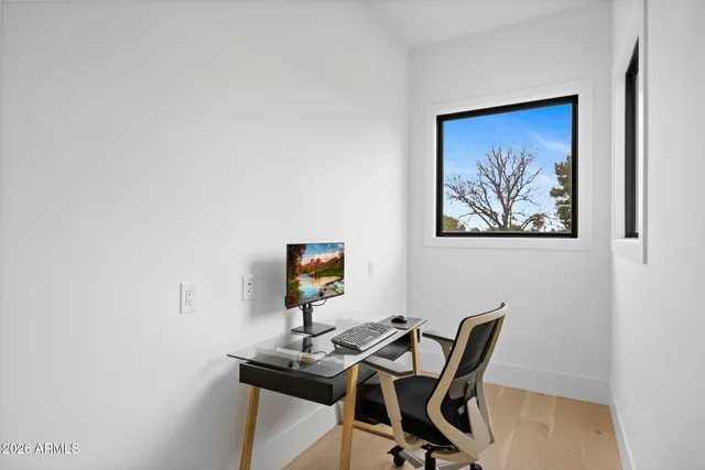 a view of a workspace with furniture