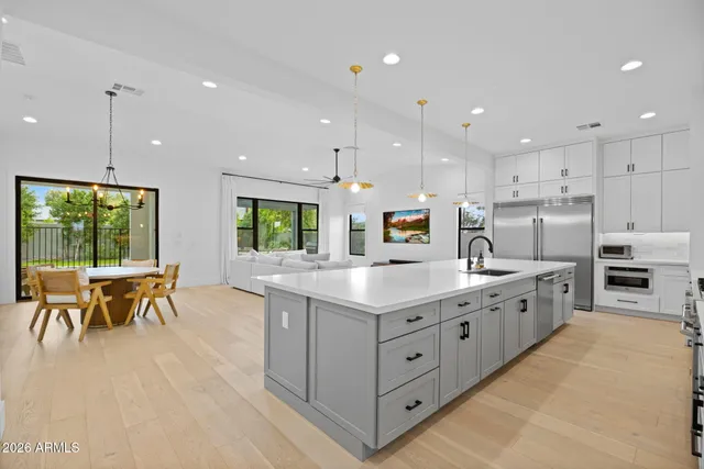 a kitchen with kitchen island granite countertop a sink and counter space
