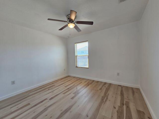 931 Merganser Way Crestview, FL 32539 - Photo 11 of 37 a view of empty room with wooden floor