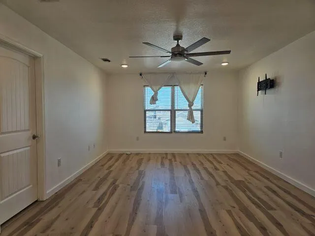 a bathroom with a granite countertop sink a large mirror and a vanity
