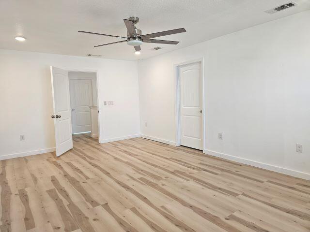 931 Merganser Way Crestview, FL 32539 - Photo 16 of 37 wooden floor in an empty room