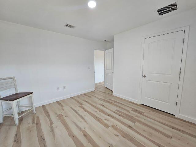 931 Merganser Way Crestview, FL 32539 - Photo 24 of 37 a view of room with wooden floor and chair