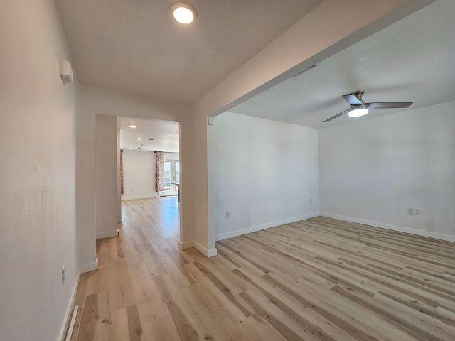 931 Merganser Way Crestview, FL 32539 - Photo 4 of 37 a view of a room with wooden floor and white walls