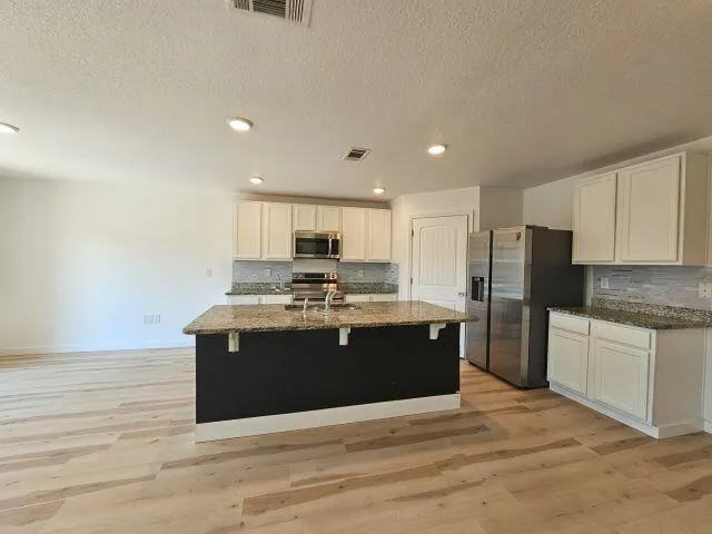 a bathroom with a toilet and a sink