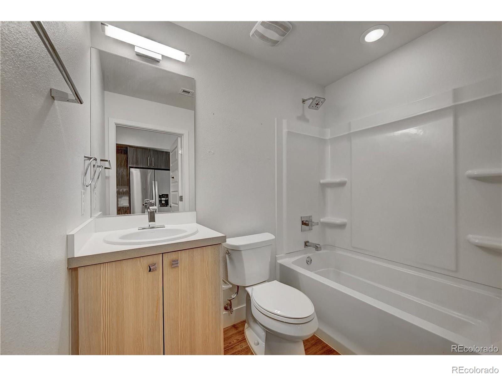 3080 Wilson Court, Unit 3 Denver, CO 80205 - Photo 14 of 28 a bathroom with a sink a toilet and shower
