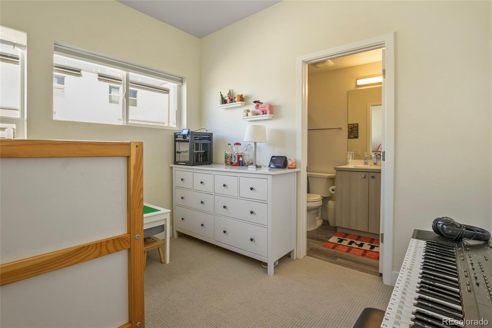 3080 Wilson Court, Unit 3 Denver, CO 80205 - Photo 17 of 28 a room with furniture and a dresser