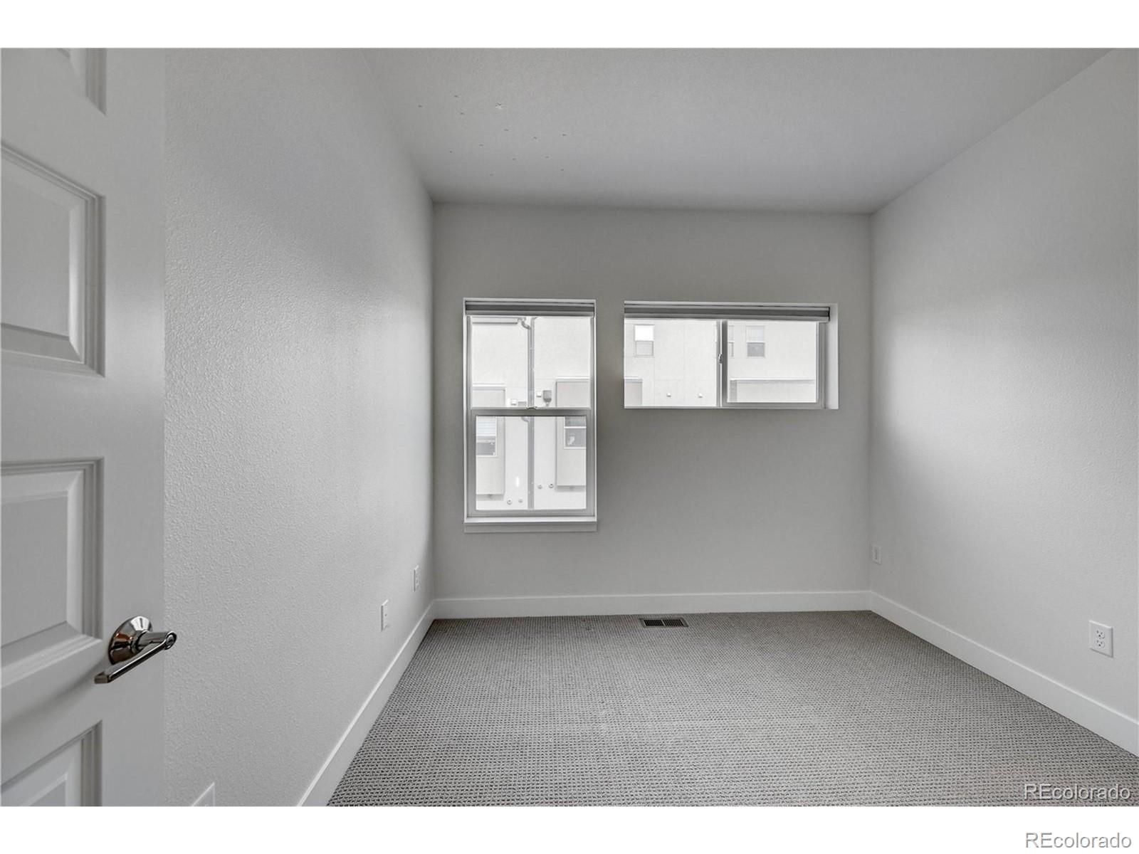 3080 Wilson Court, Unit 3 Denver, CO 80205 - Photo 18 of 28 an empty room with a window