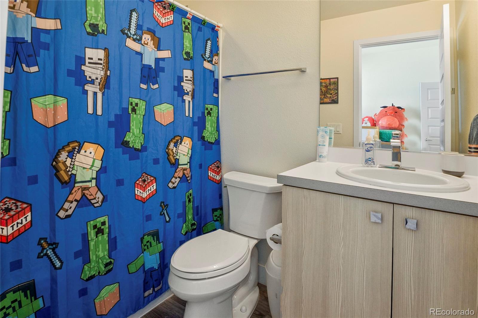 3080 Wilson Court, Unit 3 Denver, CO 80205 - Photo 19 of 28 a bathroom with a sink mirror vanity and toilet