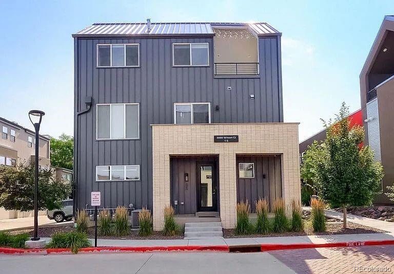 3080 Wilson Court, Unit 3 Denver, CO 80205 - Photo 3 of 28 a front view of a house with a yard