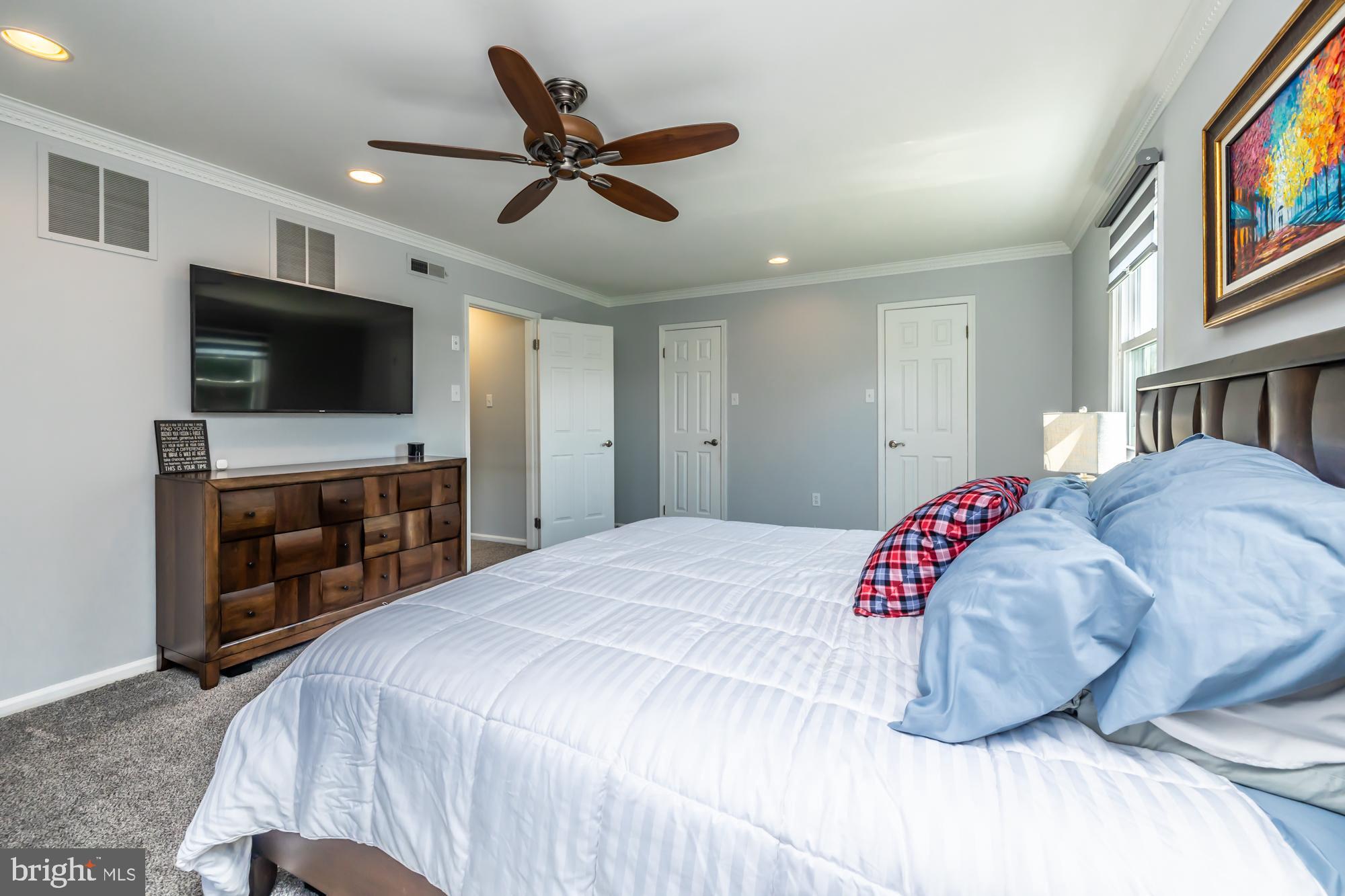 1537 Foxbury Road Ambler, PA 19002 - Photo 27 of 52 a bedroom with a bed and a flat screen tv