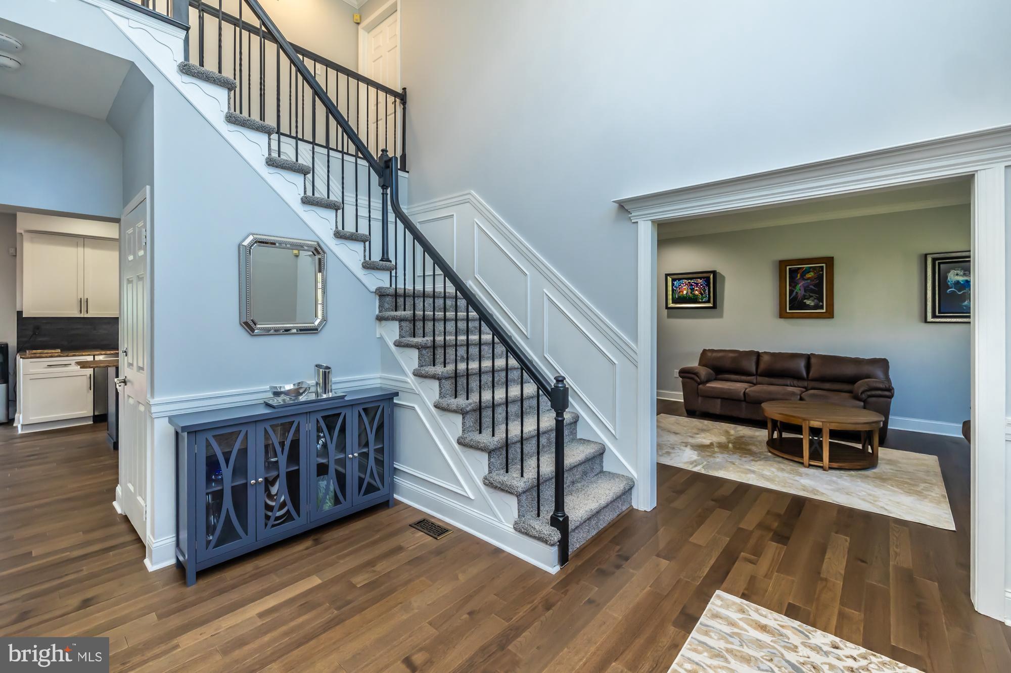 1537 Foxbury Road Ambler, PA 19002 - Photo 6 of 52 a view of staircase with furniture and wooden floor
