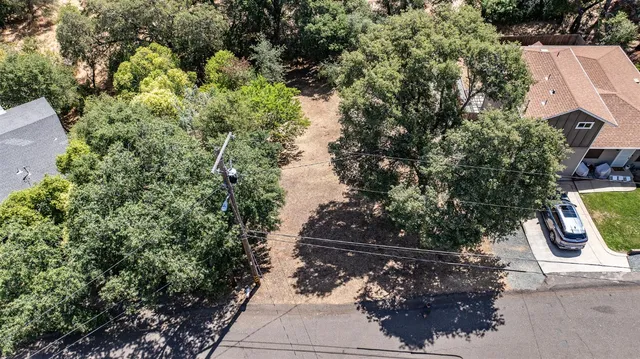 a view of street with lots of trees