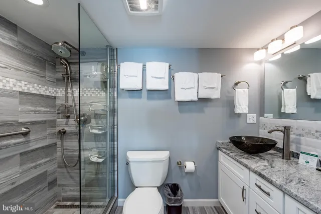 a view of a hallway with paintings on the wall