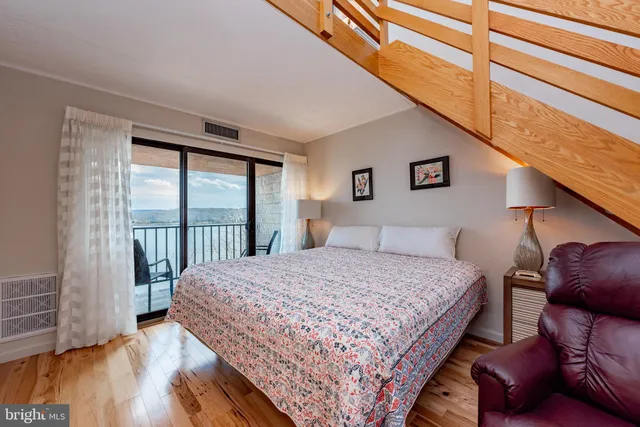 a view of living room with furniture and a flat screen tv