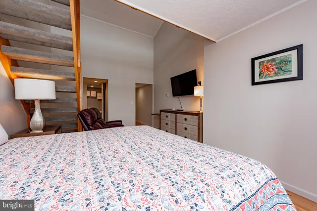 a aerial view of a house with swimming pool table and chairs