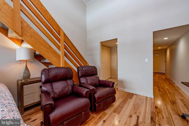 a balcony with furniture and a lake view