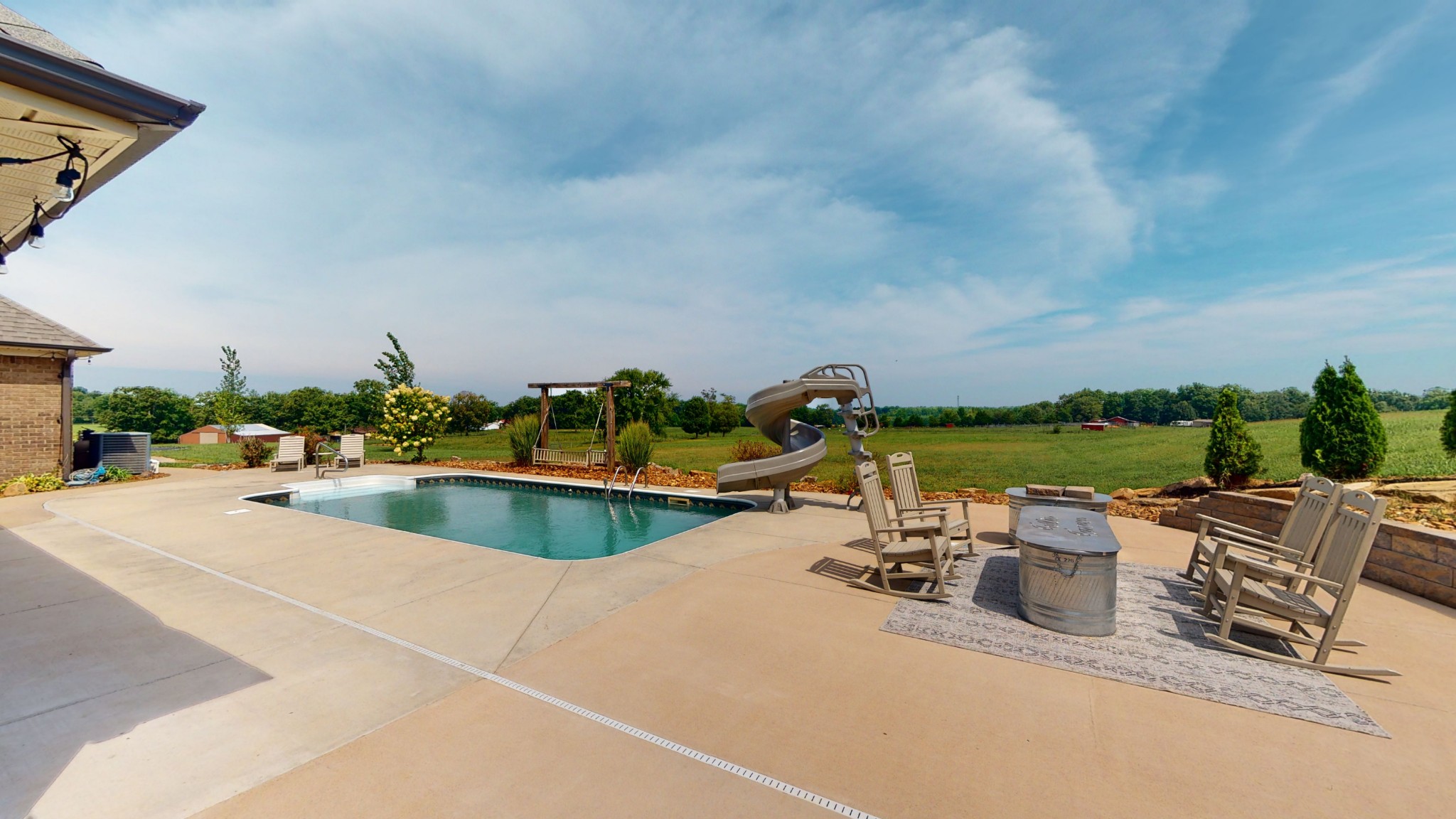106 Rhodes Road Big Sandy, TN 38221 - Photo 4 of 49 a view of a swimming pool with a patio