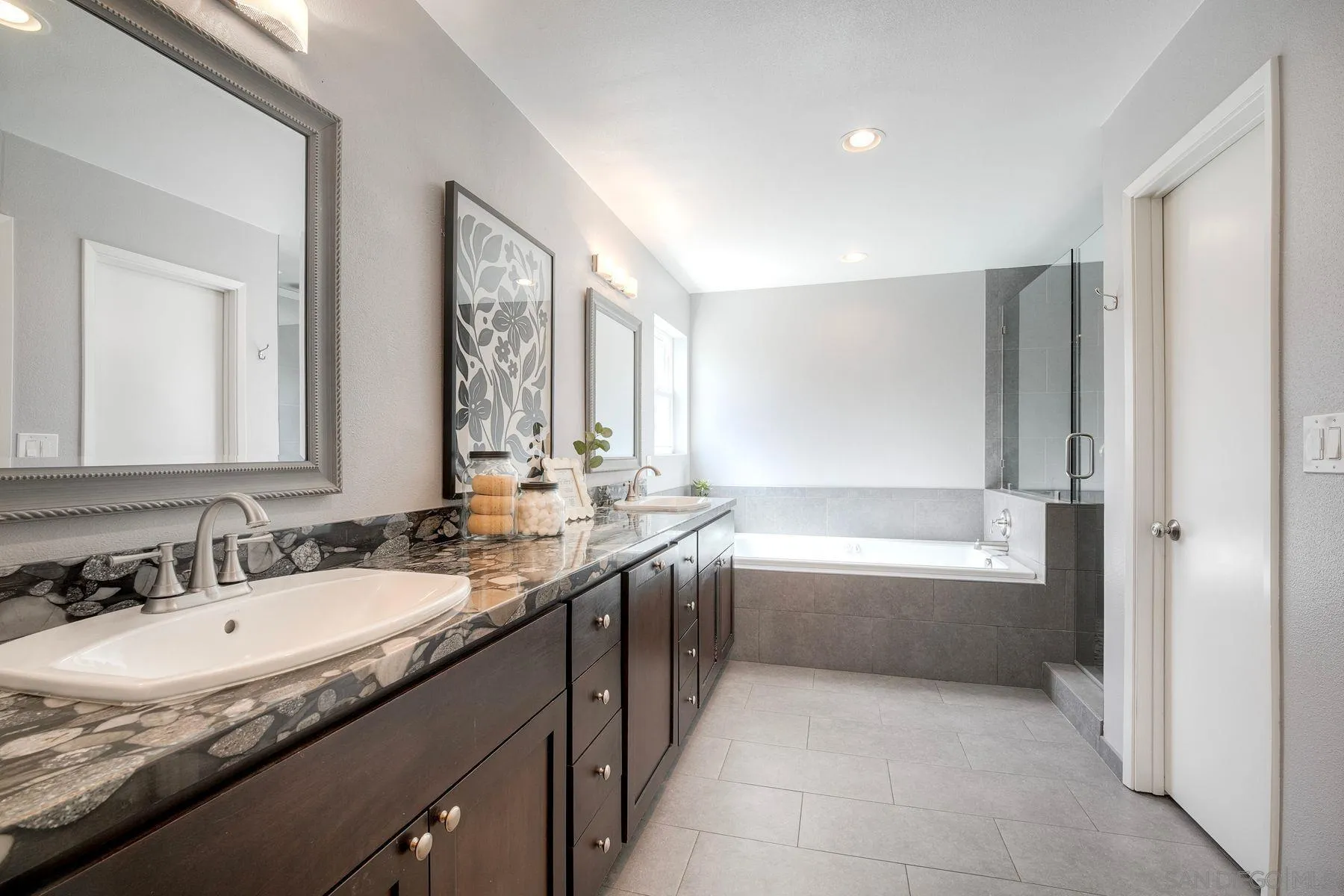 17240 Cuvee Court Poway, CA 92064 - Photo 15 of 62 a bathroom with a granite countertop sink mirror and a bathtub