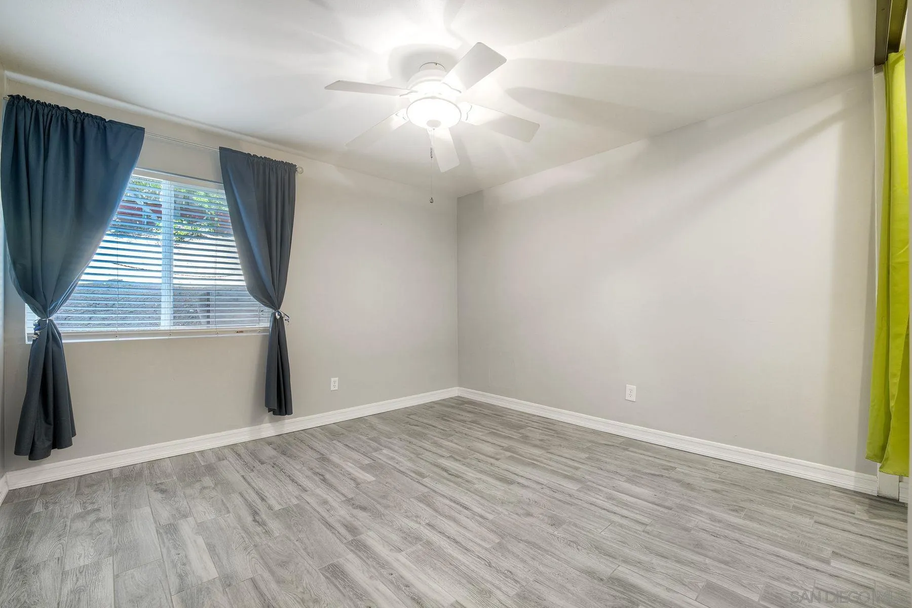 17240 Cuvee Court Poway, CA 92064 - Photo 20 of 62 wooden floor in an empty room with a window