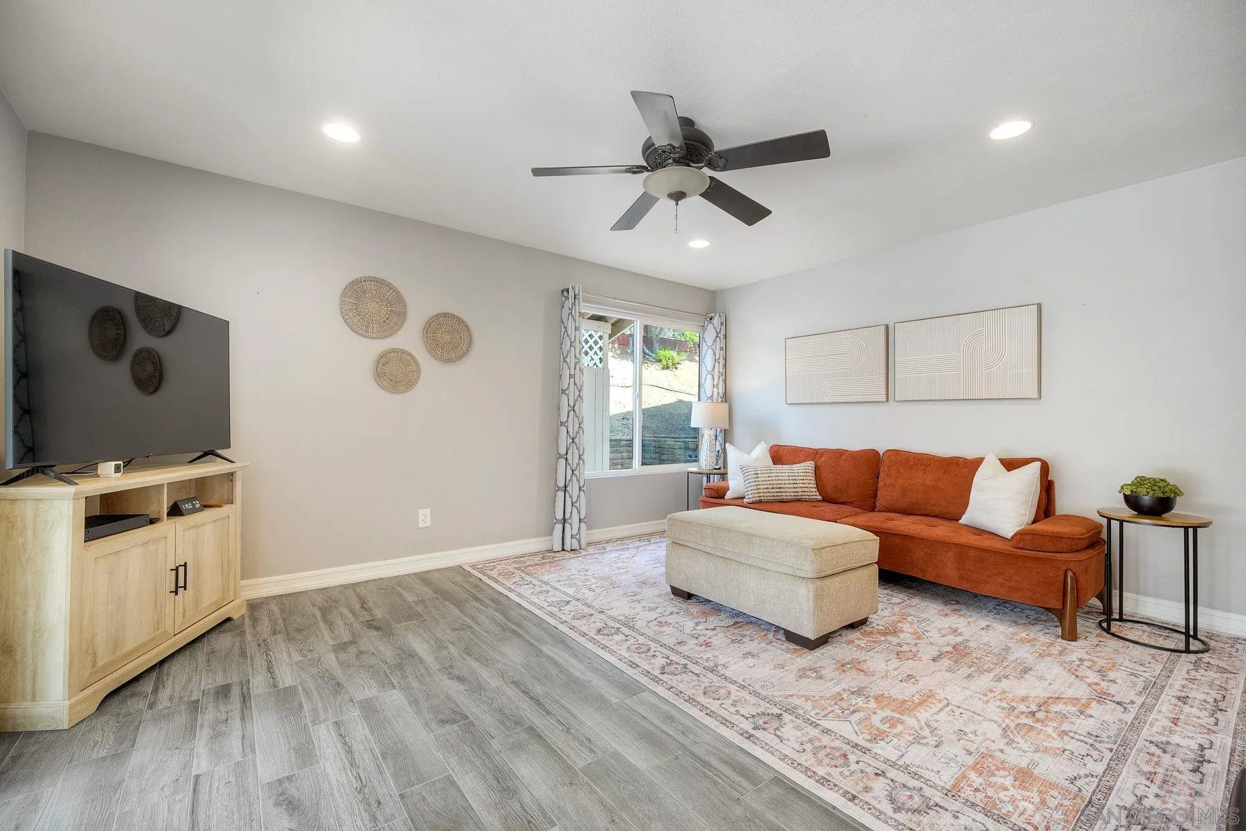 17240 Cuvee Court Poway, CA 92064 - Photo 26 of 62 a spacious bedroom with a bed and a flat screen tv