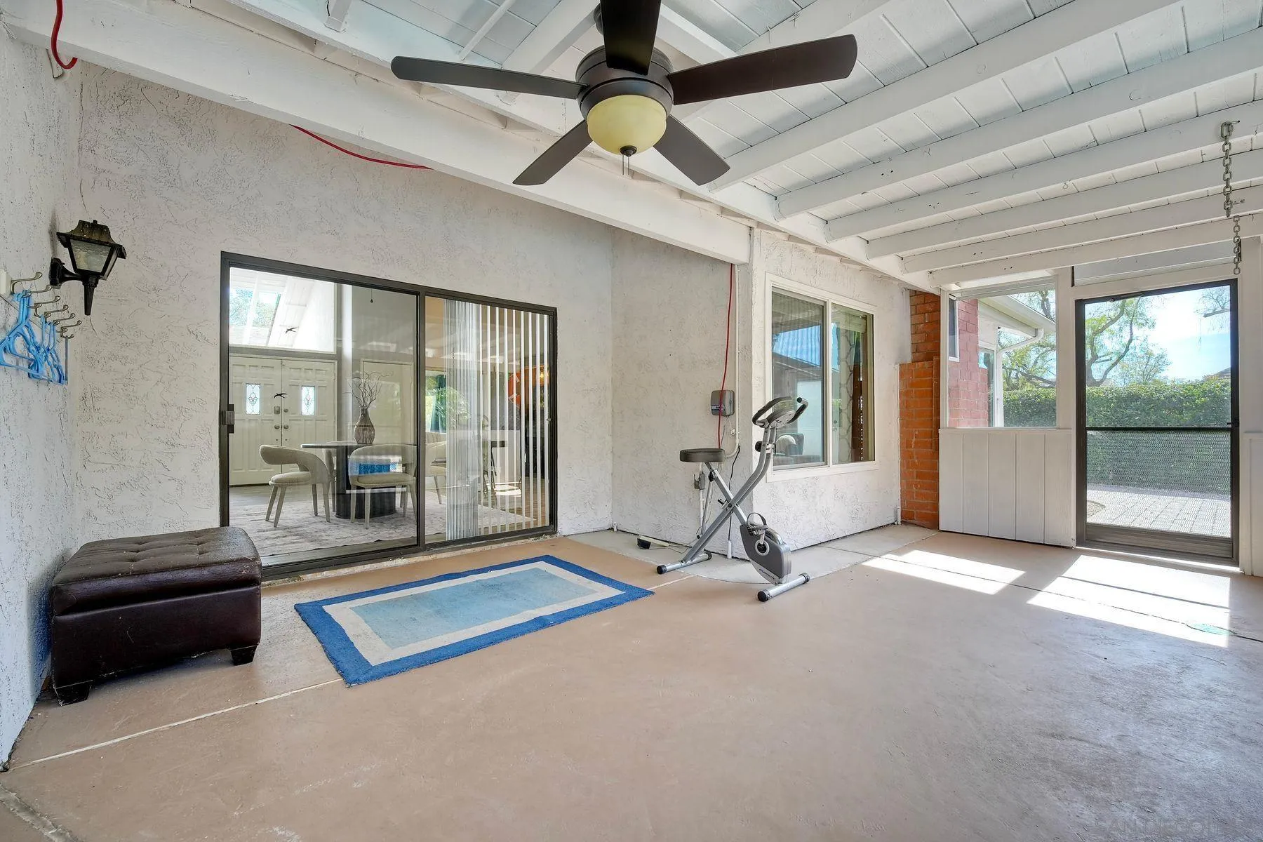 17240 Cuvee Court Poway, CA 92064 - Photo 32 of 62 a living room with couch guitar and outer view