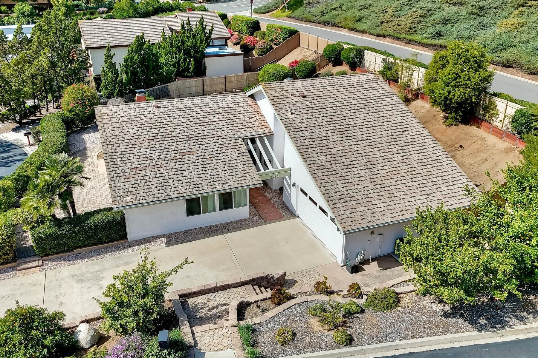17240 Cuvee Court Poway, CA 92064 - Photo 44 of 62 an aerial view of a house with a yard and potted plants