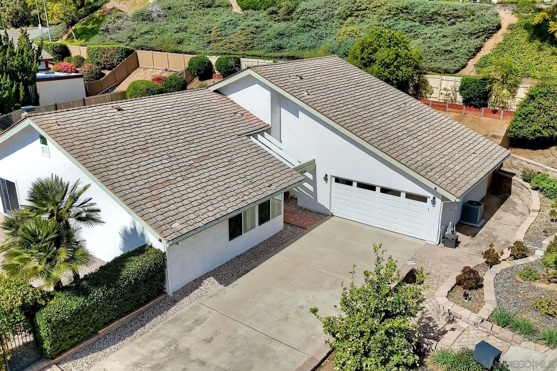 17240 Cuvee Court Poway, CA 92064 - Photo 46 of 62 a view of a house with a yard and potted plants