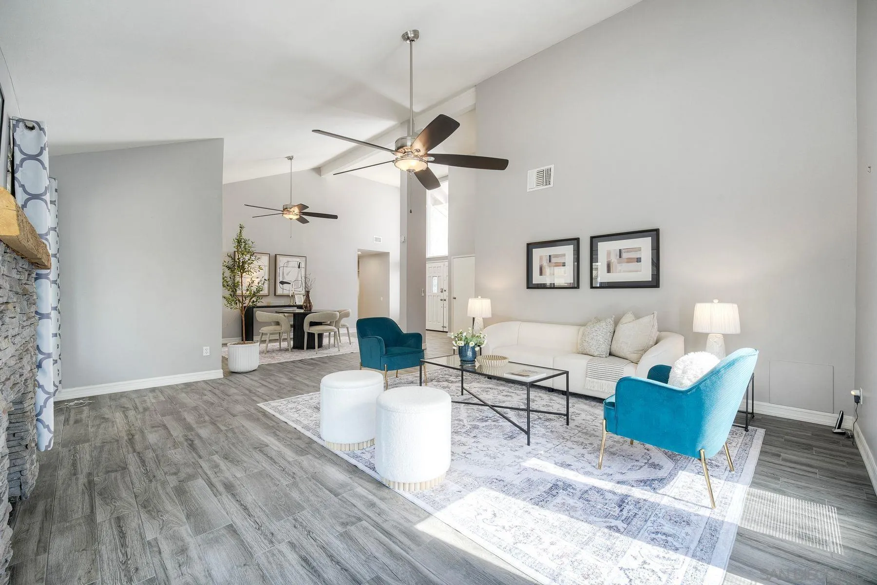 17240 Cuvee Court Poway, CA 92064 - Photo 8 of 62 a living room with furniture a rug and a chandelier