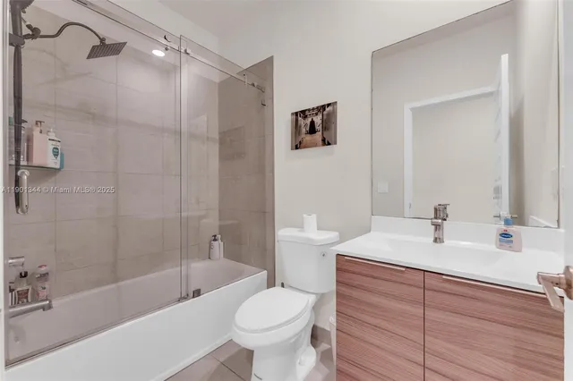 a bathroom with a tub and a shower