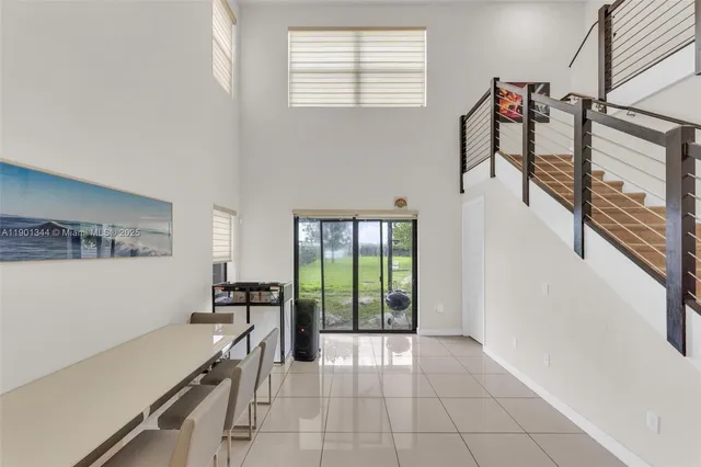a bathroom with a toilet a sink a mirror and vanity