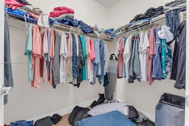 a view of a hallway with chairs