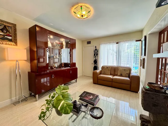 a bed room with a bed and a large window