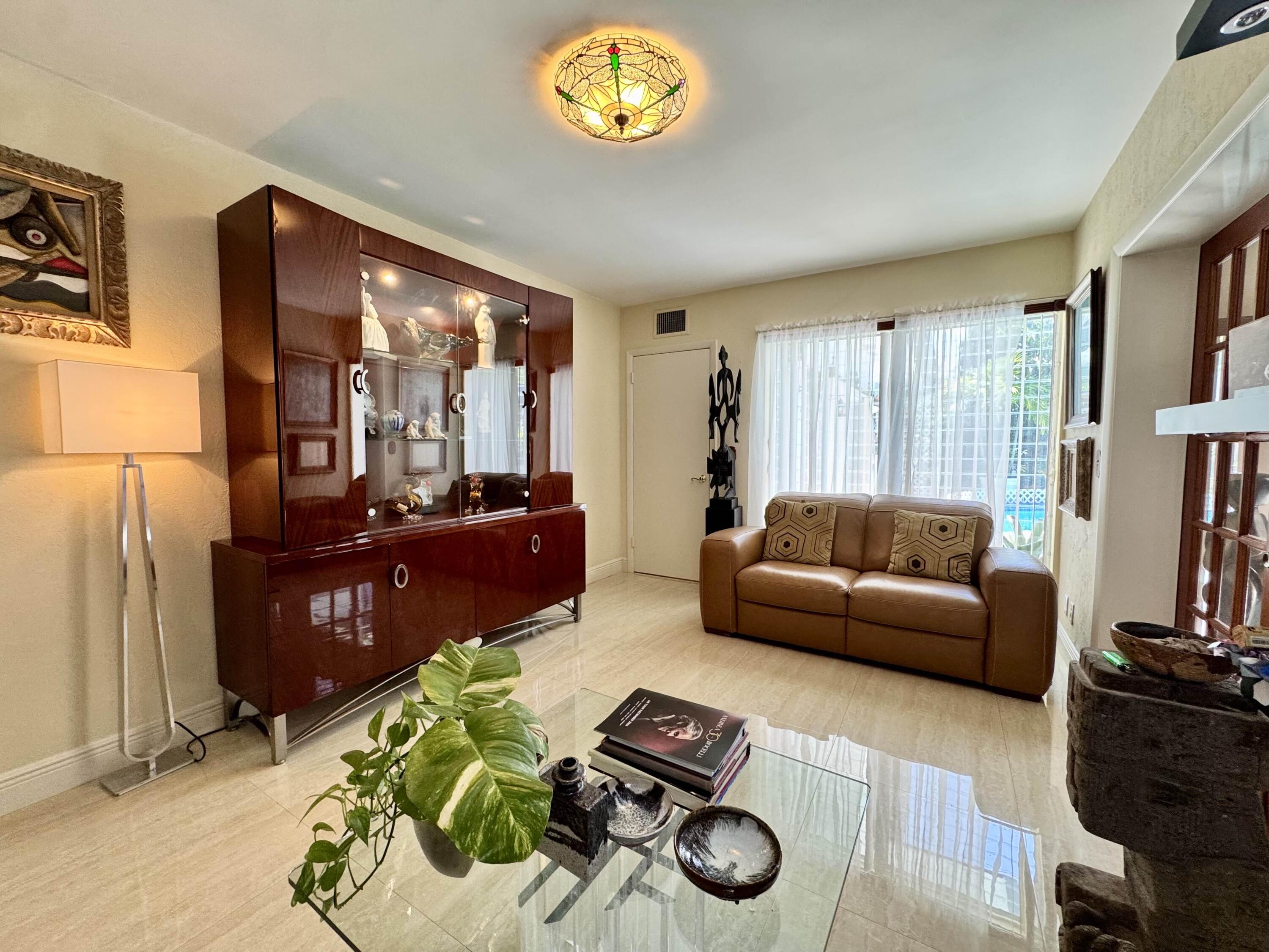 2802 Southwest 4th Street Boynton Beach, FL 33435 - Photo 18 of 42 a living room with furniture and a wooden floor