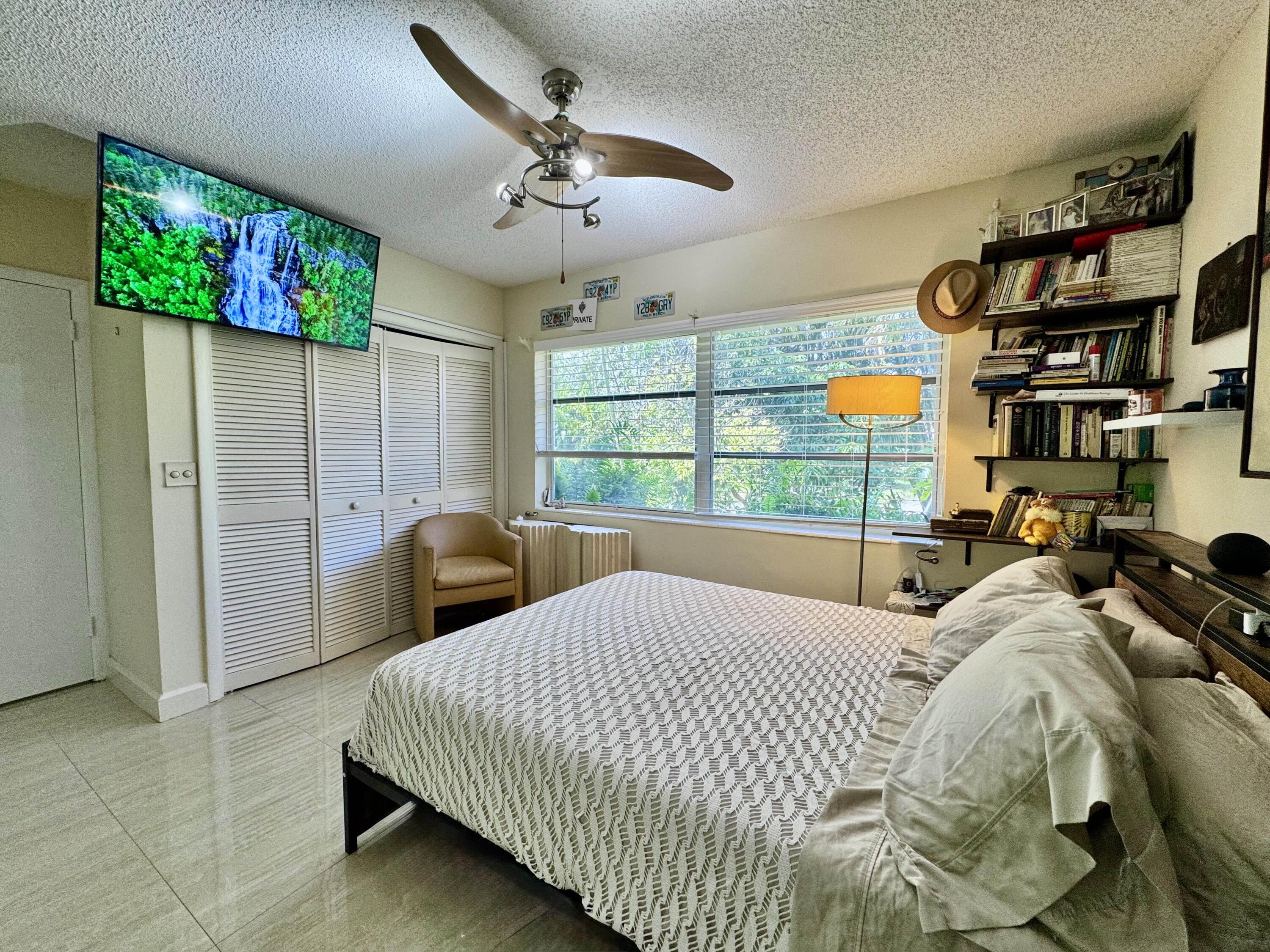 2802 Southwest 4th Street Boynton Beach, FL 33435 - Photo 20 of 42 a bedroom with bed and window
