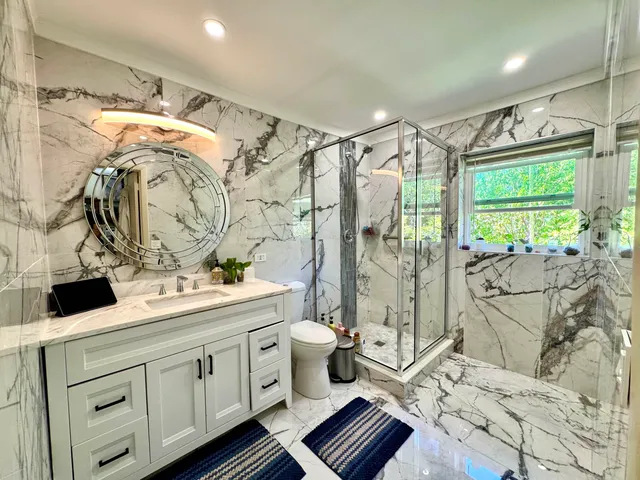 a view of a workspace with furniture and a lounge chair