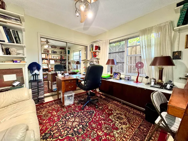 a view of a workspace with furniture and toys