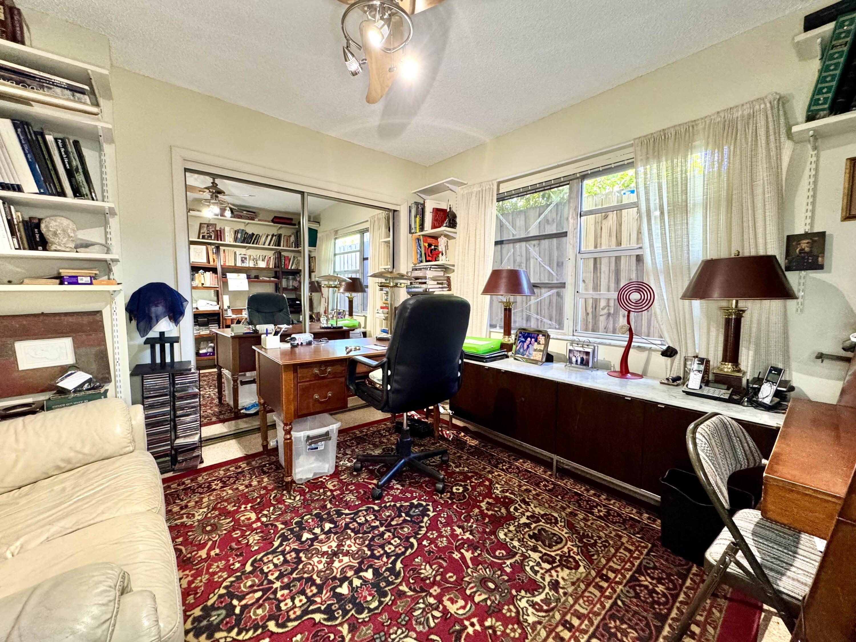 2802 Southwest 4th Street Boynton Beach, FL 33435 - Photo 23 of 42 a view of a workspace with furniture and a lounge chair