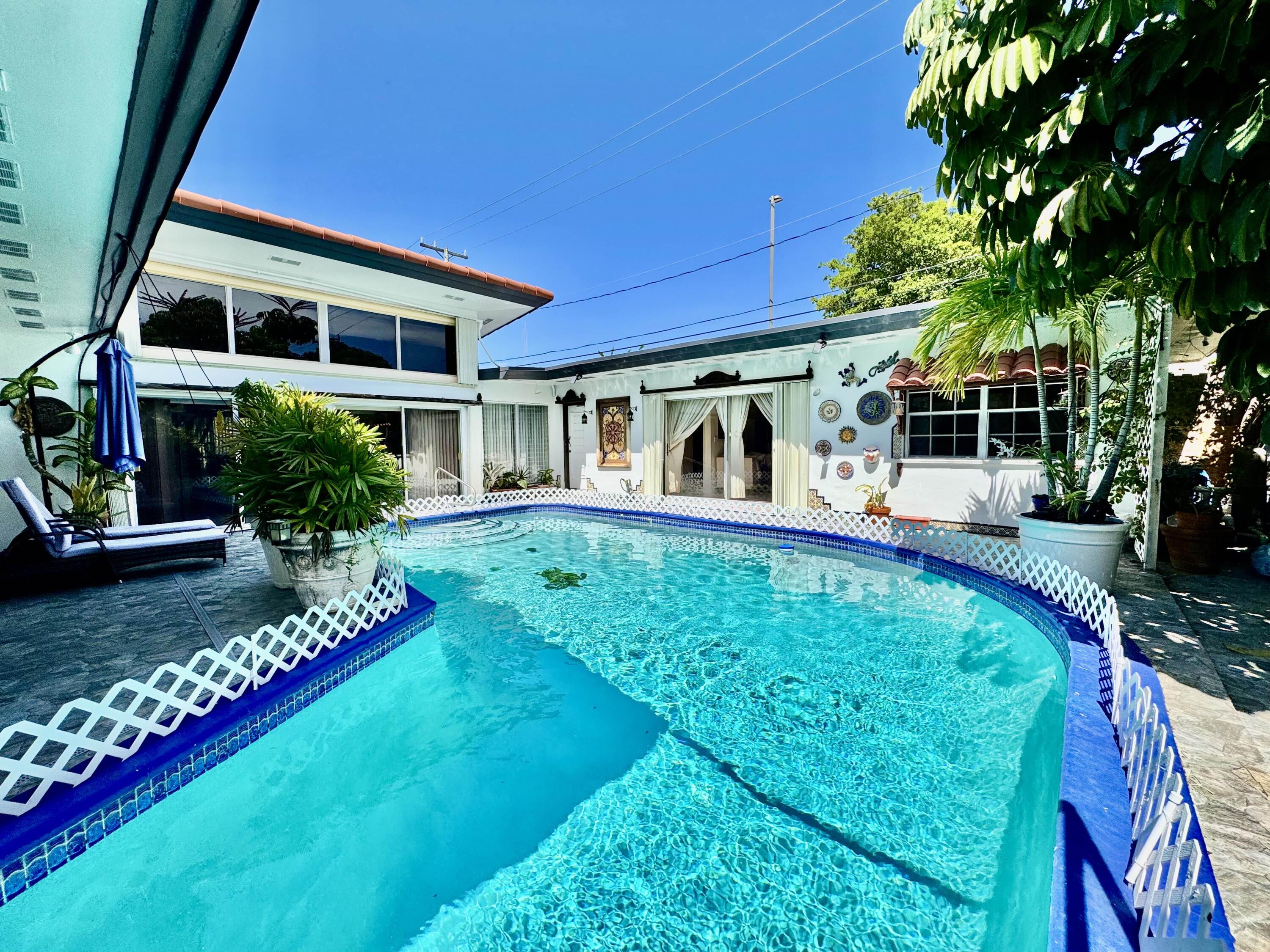 2802 Southwest 4th Street Boynton Beach, FL 33435 - Photo 32 of 42 a view of house with swimming pool outdoor seating