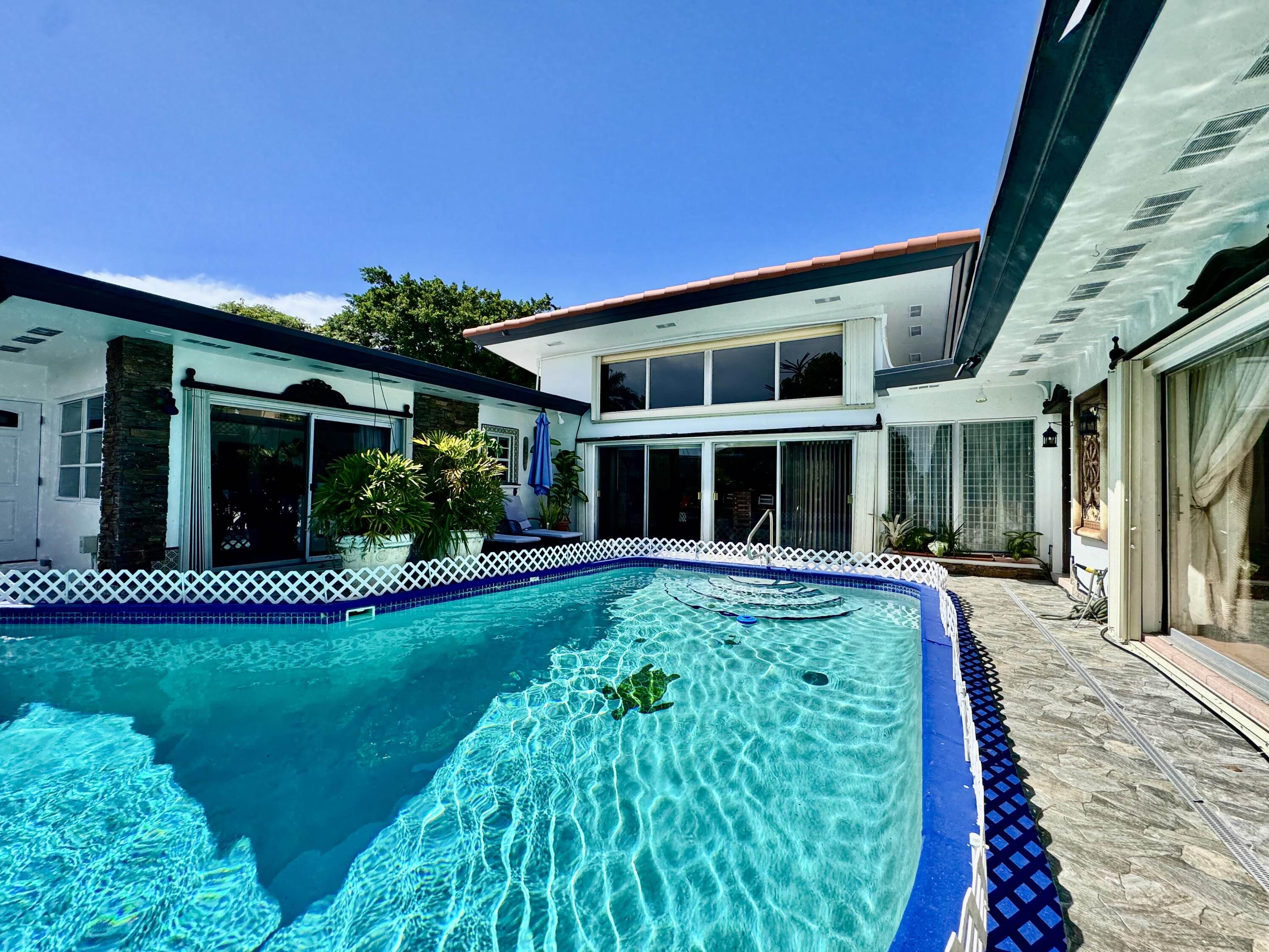 2802 Southwest 4th Street Boynton Beach, FL 33435 - Photo 34 of 42 a front view of a house with a yard