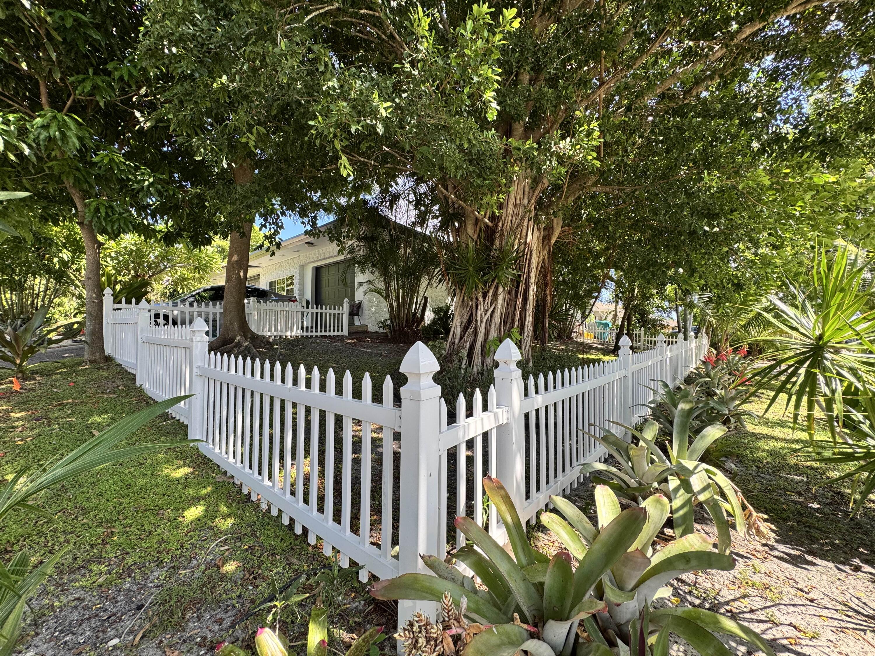 2802 Southwest 4th Street Boynton Beach, FL 33435 - Photo 42 of 42 a view of a house with a flower garden