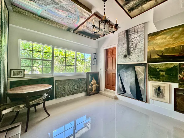 a view of a livingroom with furniture and a window