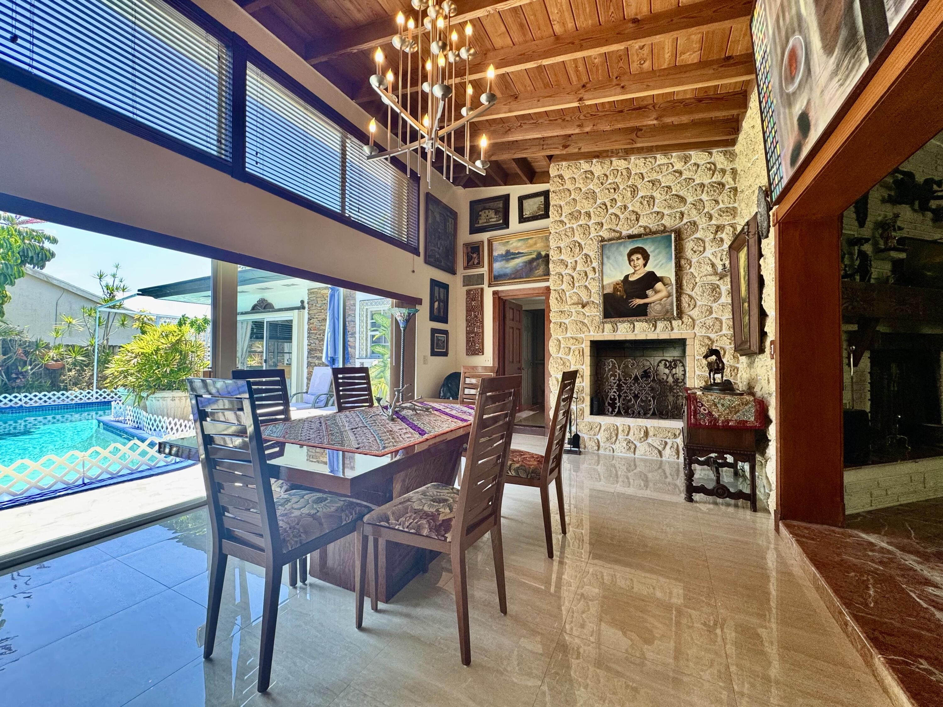 2802 Southwest 4th Street Boynton Beach, FL 33435 - Photo 9 of 42 a view of a dining room with furniture window and wooden floor