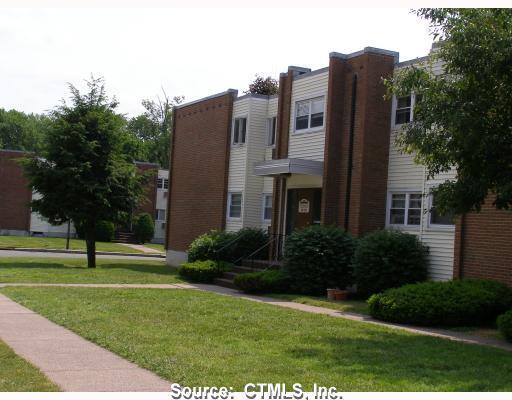 a view of a building with a yard