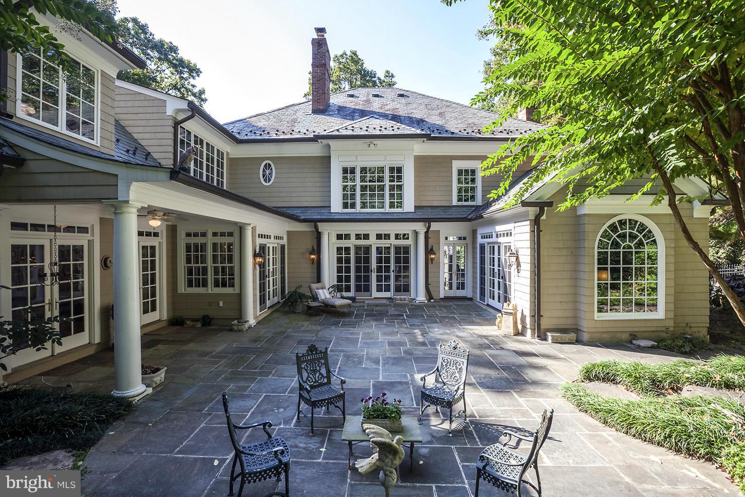 7414 Dulany Drive McLean, VA 22101 - Photo 13 of 30 a front view of a house with garden and porch