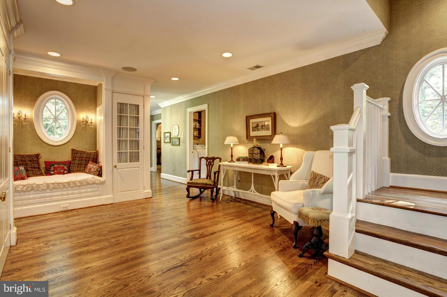 7414 Dulany Drive McLean, VA 22101 - Photo 20 of 30 a living room with furniture a clock on wall and a table