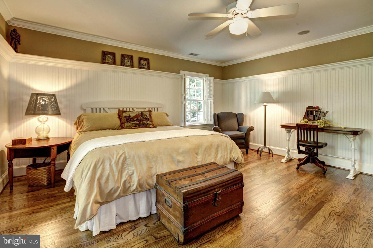 7414 Dulany Drive McLean, VA 22101 - Photo 21 of 30 a bed room with a bed and a lamp