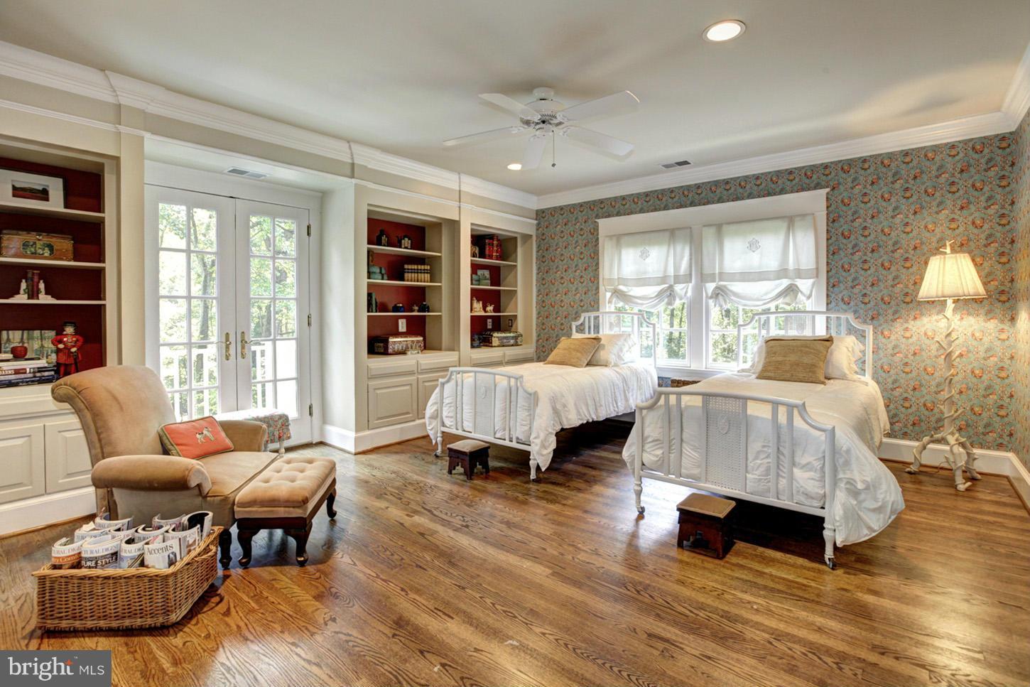 7414 Dulany Drive McLean, VA 22101 - Photo 22 of 30 a spacious bedroom with a bed and wooden floor