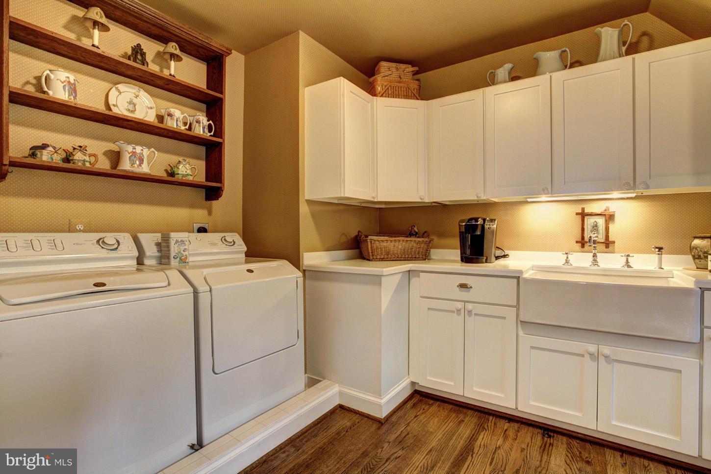 7414 Dulany Drive McLean, VA 22101 - Photo 24 of 30 a utility room with dryer and washer
